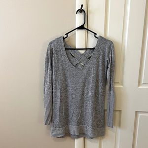 Cross back long sleeve shirt. Free gift with purchase.